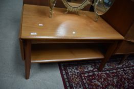 A vintage teak drop leaf coffee table