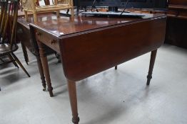 A Victorian mahogany pembroke style table