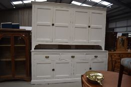 A late 19th or early 20th century and later painted kitchen butlers/housekeepers cupboard, fantastic
