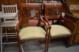 A pair of reproduction yew wood carver chairs