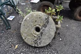 Two composite stone flower or plant pots with a grinding stone