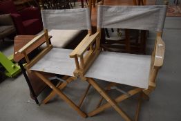 A pair of canvas and beech folding directors style chairs
