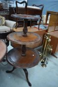 A 19th Century mahogany triple tier dumb waiter having and edged decoration, on triple splay legs