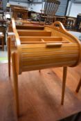 A vintage tambour top sewing box and a small quantity of cotton reels etc