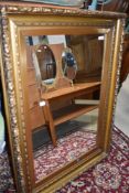 A large gilt frame wall mirror