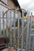 A pair of late Victorian cast iron street lights having swan neck and acanthus style base
