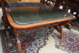 A reproduction Regency coffee table having skiver top