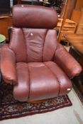 A brown leather Stressless style chair, chinese marks to adjuster
