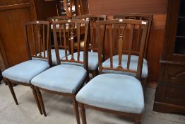 A set of reproduction dining chairs