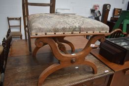 A 19th Century walnut cross frame dressing stool