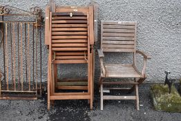 A selection of four teak garden chairs