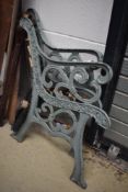 A pair of cast iron bench ends