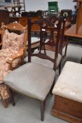 A pair of early 20th Century dining chairs having later dralon upholstery