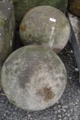 A pair of hand carved sand stone Atlas style balls or globes