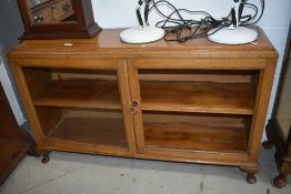 A golden oak low bookcase, no glass to right door