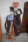 A selection of vintage golf clubs, tennis rackets etc