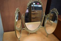 A vintage metal frame triptych dressing table mirror