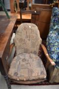 A vintage low seat easy arm chair