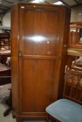 An early 20th Century oak corner hall robe