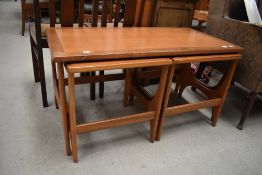 A vintage teak coffee table nest, width approx. 99cm