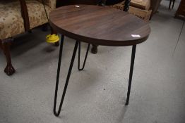A vintage style occasional table with hair grip style legs