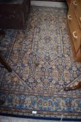 A traditional rug, in blues and golds