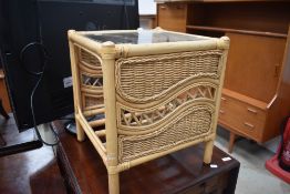 A canework and glass occasional table