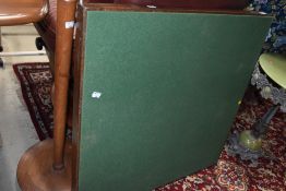 A traditional square folding card table