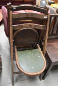 A pair of vintage folding chairs