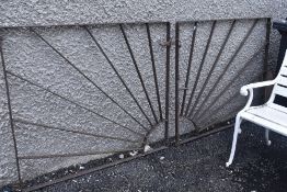 A pair of iron art deco sun burst design drive way or garden gates