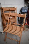Four beech folding chairs (two sets of two including Ikea Terje)