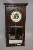 An Edwardian hall way mirror and aneroid