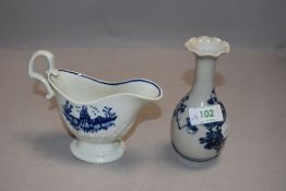 A 19th century English porcelain blue and white sauce boat, acanthus moulded and decorated with