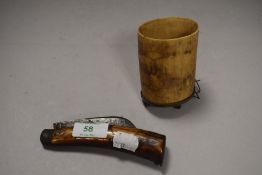 A rustic horn handled penknife and a horn vase on metal base, two feet missing