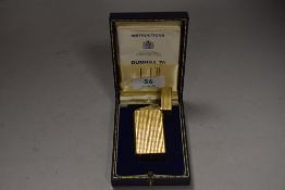 A 20th century cigarette lighter by Dunhill having guilloche worked case and box no ZA474