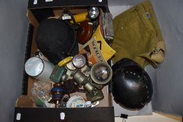 A miscellany of items including vintage helmets, 1942 MKII gas mask bag,tape measure and more.