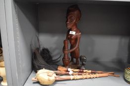 A selection of tribal art including figures and instrument