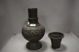 A Chinese or Japanese vase possibly late Qing dynasty having double panels of birds in cherry