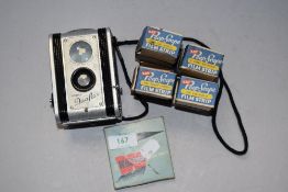 A vintage Kodak Duaflex camera and selection of film, mainly being Kay Peep scope
