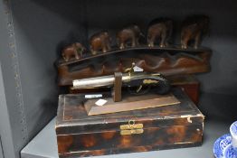 Two jewellery boxes, a replica flintlock pistol on stand and a carved ornament