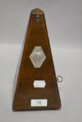 A traditional metronome, labelled Paquet, in running order