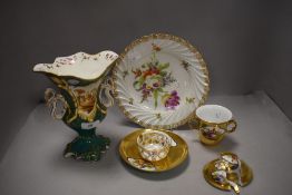 A selection of antique porcelain including mantle vase and chocolate cup with plate