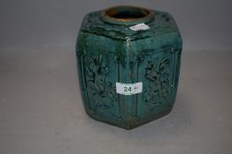 An antique Song Jun celadon glazed hexagonal ginger jar with embossed panels of plants and foliage