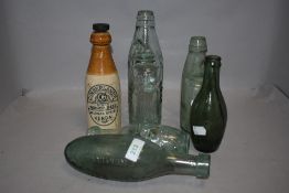 Six advertising bottles including stoneware Ginger beer bottle of Kendal interest and codd bottle of