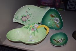 A set of vintage kitchen scales and a 1953 coronation souvenir biscuit tin.