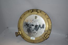 A brass porthole