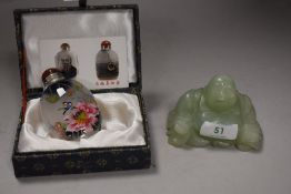 A Jade figure modelled as seated budda and an Oriental tourist perfume bottle