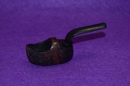 A novelty pipe on a black forest style modelled as a clog