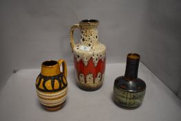 Three vintage pottery vases including German and Celtic Newlyn