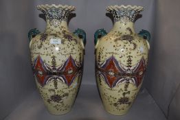 A pair of large Oriental style two handled vases having tube lined style decoration, height approx